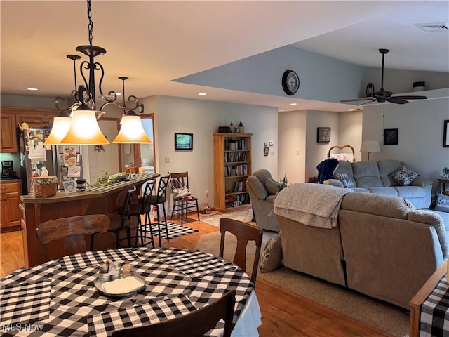 617 Wedgewood Way Unit 617, Millersburg, OH 44654 - dining space with light wood-style flooring, a ceiling fan, recessed lighting, and vaulted ceiling