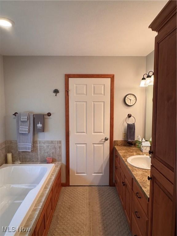 617 Wedgewood Way Unit 617, Millersburg, OH 44654 - bathroom featuring vanity and a garden tub