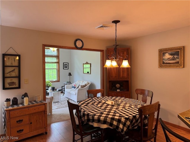 617 Wedgewood Way Unit 617, Millersburg, OH 44654 - dining space featuring wood finished floors and a chandelier