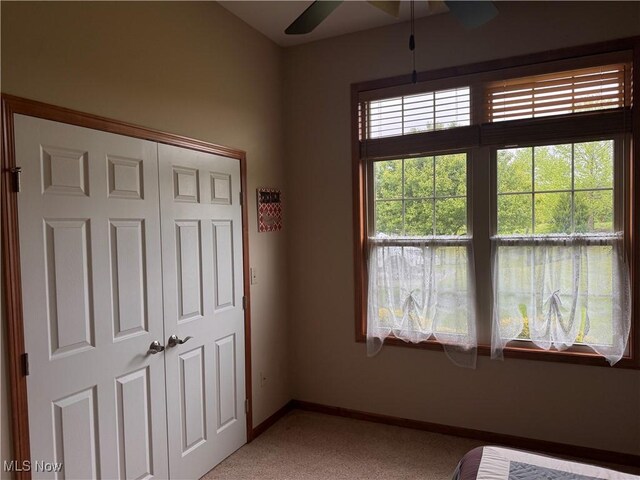 617 Wedgewood Way Unit 617, Millersburg, OH 44654 - unfurnished bedroom with light carpet, baseboards, and a closet