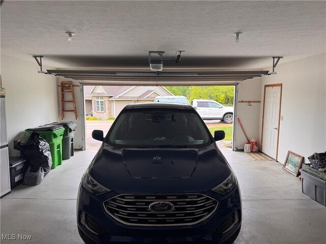 617 Wedgewood Way Unit 617, Millersburg, OH 44654 - garage with a garage door opener