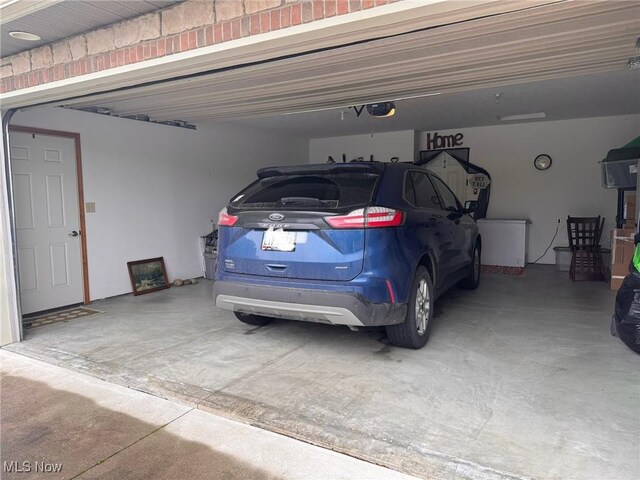 617 Wedgewood Way Unit 617, Millersburg, OH 44654 - garage featuring a garage door opener