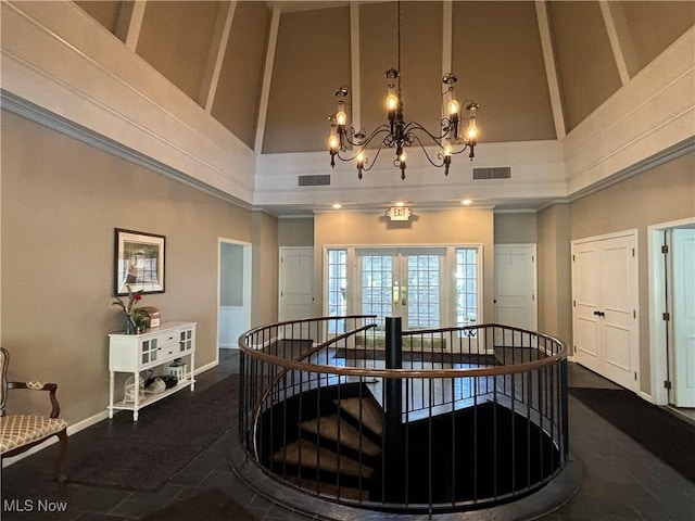 1931 King James Unit 131, Westlake, OH 44145 - corridor with high vaulted ceiling, an upstairs landing, a chandelier, and baseboards
