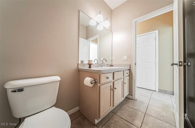 2768 Rising Meadow Dr, Akron, OH 44333 - bathroom with toilet, vanity, tile patterned floors, and baseboards