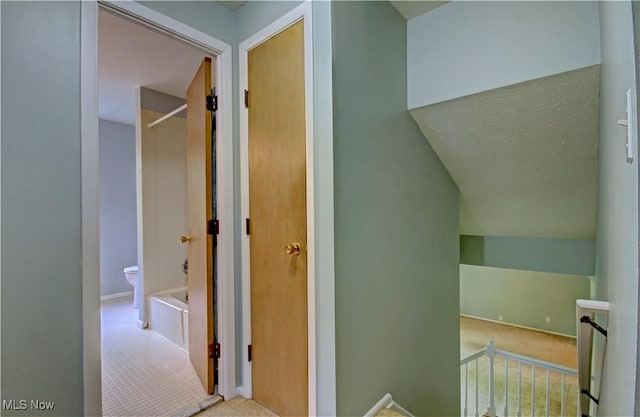 29590 Broxbourne Rd, North Olmsted, OH 44070 - corridor with carpet floors, baseboards, and an upstairs landing