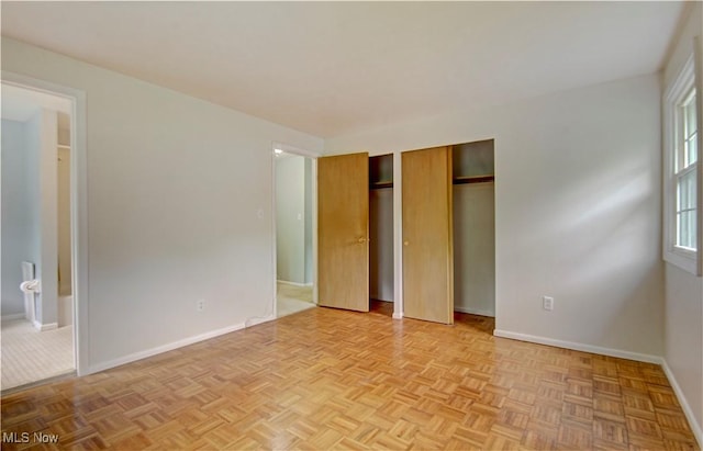 29590 Broxbourne Rd, North Olmsted, OH 44070 - unfurnished bedroom with multiple closets, baseboards, and ensuite bathroom