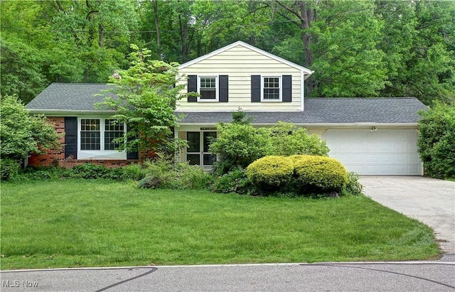 29590 Broxbourne Rd, North Olmsted, OH 44070 - view of front facade with concrete driveway, an attached garage, a front yard, a shingled roof, and brick siding