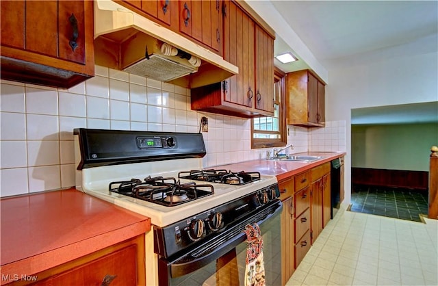 29590 Broxbourne Rd, North Olmsted, OH 44070 - kitchen with white range with gas stovetop, a sink, light countertops, and under cabinet range hood