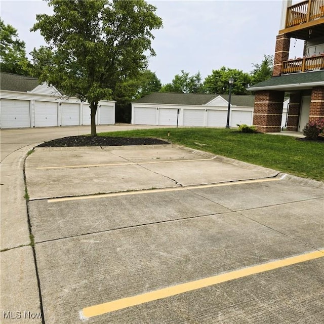 23002 Chandlers Ln Unit 101, Olmsted Falls, OH 44138 - view of vehicle parking featuring community garages