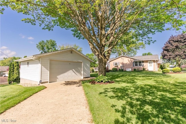 2022 Eloise Cir NE, Hartville, OH 44632 - view of front facade featuring a detached garage, an outbuilding, and a front lawn