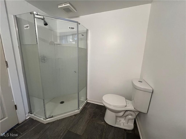 764 Jones St, Hubbard, OH 44425 - bathroom featuring toilet, baseboards, and a shower stall