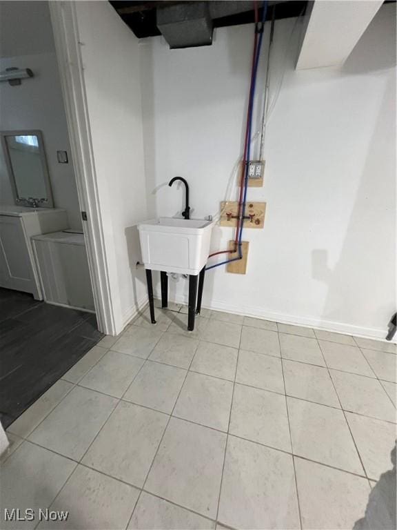 764 Jones St, Hubbard, OH 44425 - basement with light tile patterned floors and baseboards