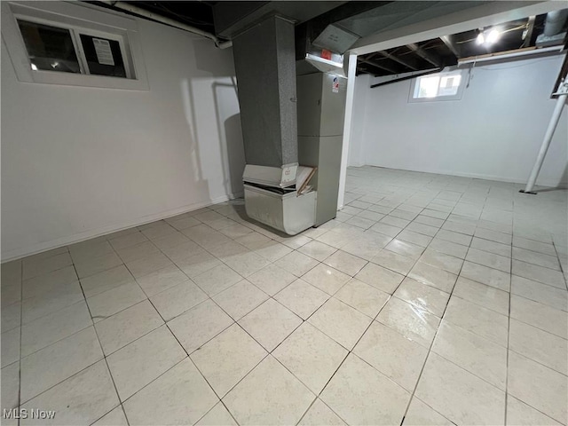 764 Jones St, Hubbard, OH 44425 - basement with light tile patterned floors and heating unit