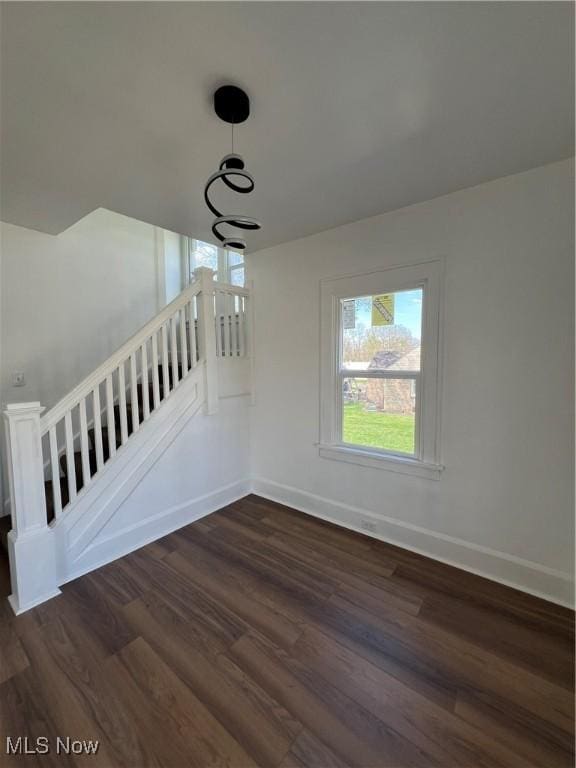 764 Jones St, Hubbard, OH 44425 - empty room featuring dark wood-style floors and baseboards