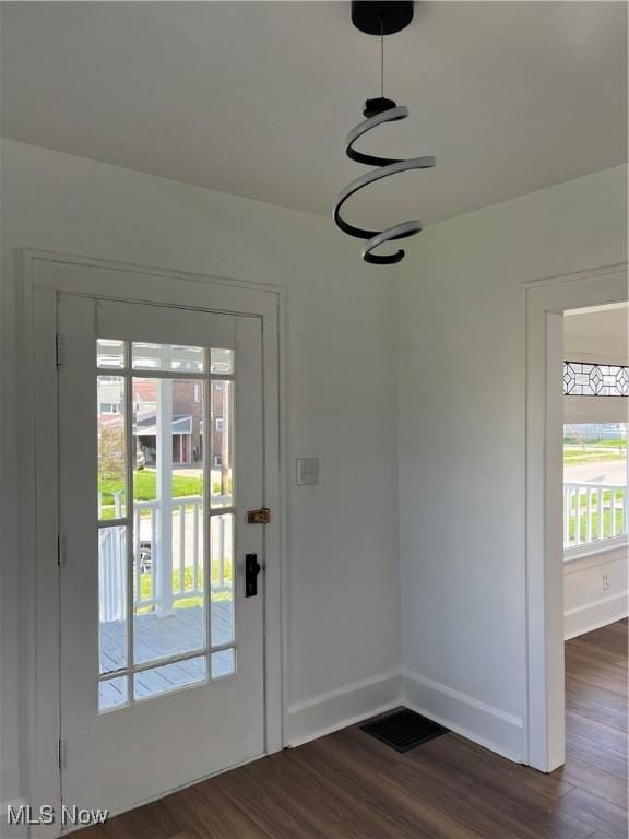 764 Jones St, Hubbard, OH 44425 - entryway featuring dark wood-type flooring, plenty of natural light, and baseboards