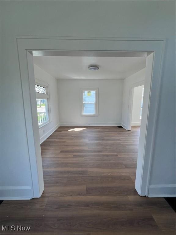 764 Jones St, Hubbard, OH 44425 - empty room with plenty of natural light, dark wood finished floors, and baseboards