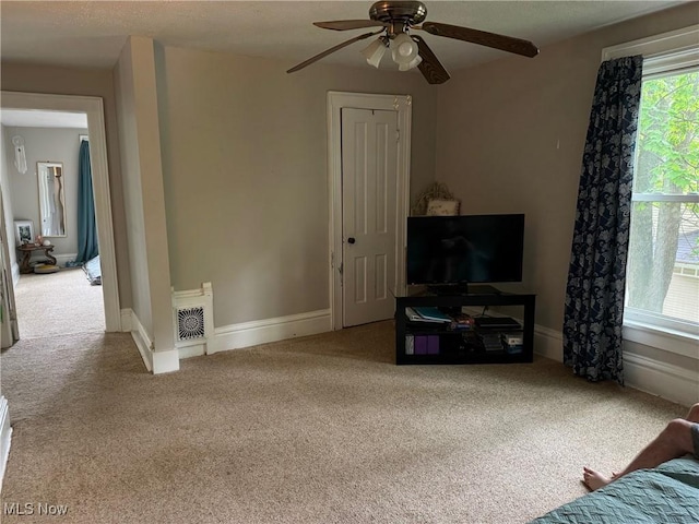 98 Westwood Ave, Akron, OH 44302 - carpeted living room with a ceiling fan and baseboards