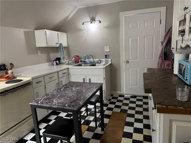 98 Westwood Ave, Akron, OH 44302 - kitchen with white range with electric cooktop, tile patterned floors, stainless steel microwave, a sink, and white cabinets