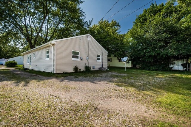 2226 Martha Ave NE, Canton, OH 44705 - view of side of property featuring a yard
