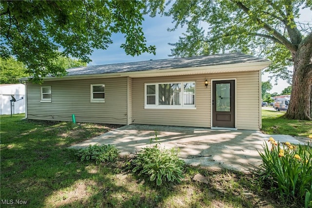 2226 Martha Ave NE, Canton, OH 44705 - back of property with a patio and a yard