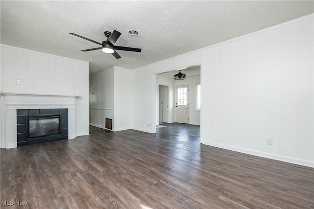 2226 Martha Ave NE, Canton, OH 44705 - unfurnished living room featuring dark wood finished floors, ceiling fan, a fireplace, a textured ceiling, and baseboards