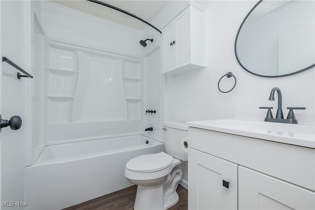 2226 Martha Ave NE, Canton, OH 44705 - full bathroom with vanity, toilet,  shower combination, and wood finished floors