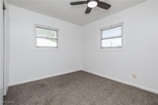 2226 Martha Ave NE, Canton, OH 44705 - carpeted empty room with baseboards and ceiling fan