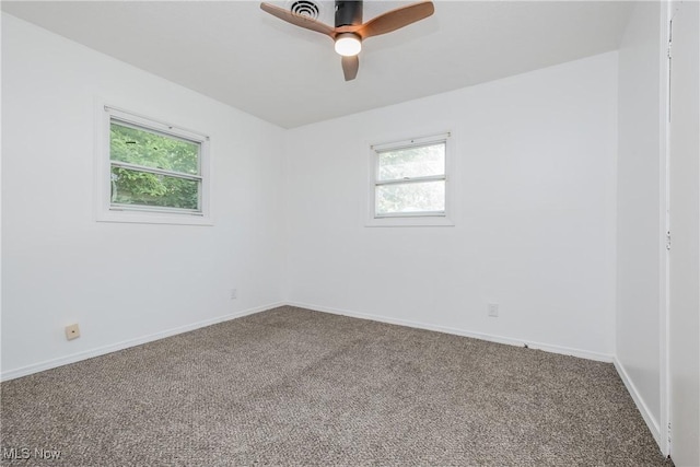 2226 Martha Ave NE, Canton, OH 44705 - empty room with carpet flooring, a ceiling fan, and baseboards