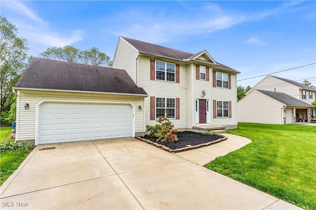 25861 Kennedy Ridge Rd, North Olmsted, OH 44070 - view of front of home with an attached garage, a front yard, and driveway