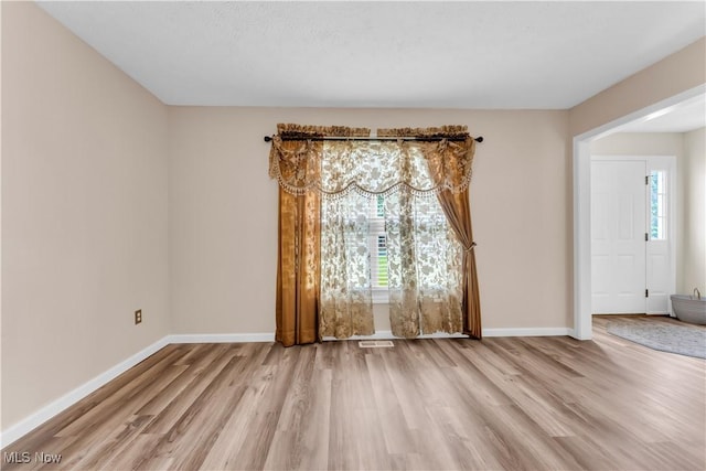 25861 Kennedy Ridge Rd, North Olmsted, OH 44070 - spare room featuring wood finished floors, healthy amount of natural light, and baseboards