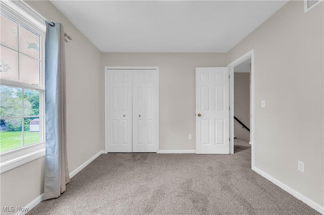 25861 Kennedy Ridge Rd, North Olmsted, OH 44070 - unfurnished bedroom with carpet floors, baseboards, and a closet