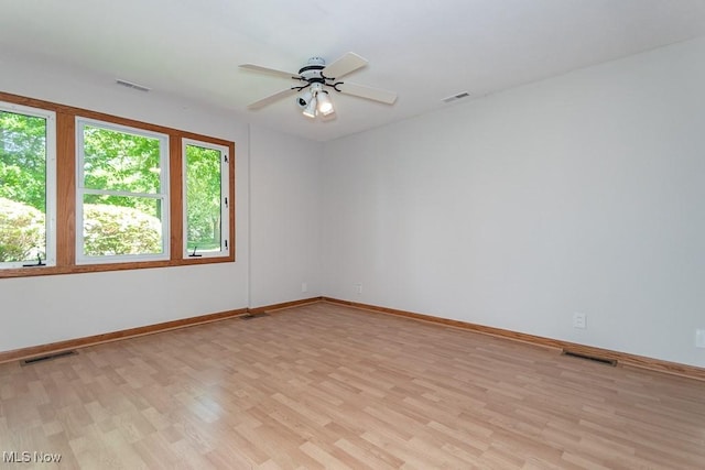 26 Middleton Dr, Painesville Township, OH 44077 - empty room with light wood-type flooring, baseboards, and a ceiling fan