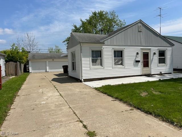 500 Grosvenor Dr NW, Massillon, OH 44647 - view of front of property featuring a detached garage, an outbuilding, and a front lawn