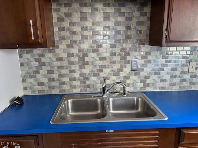 500 Grosvenor Dr NW, Massillon, OH 44647 - kitchen with a sink and tasteful backsplash