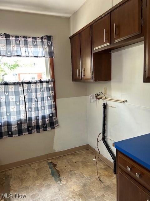 500 Grosvenor Dr NW, Massillon, OH 44647 - laundry area with stone finish floors