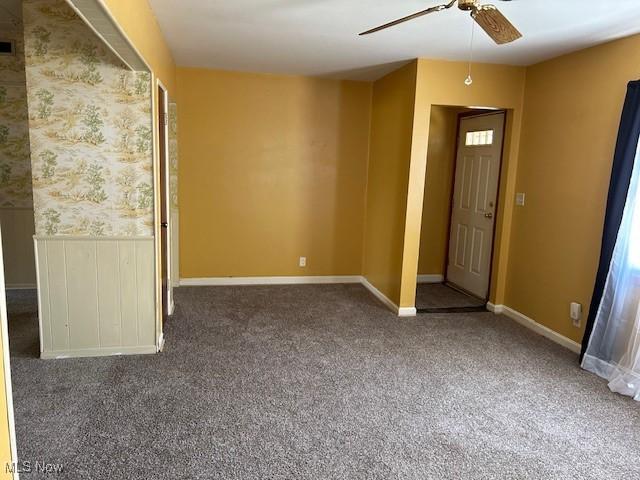 500 Grosvenor Dr NW, Massillon, OH 44647 - spare room with a ceiling fan, carpet floors, and baseboards