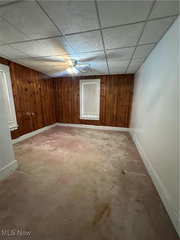 1097 Jefferson St, Follansbee, WV 26037 - empty room with baseboards, wooden walls, and a drop ceiling
