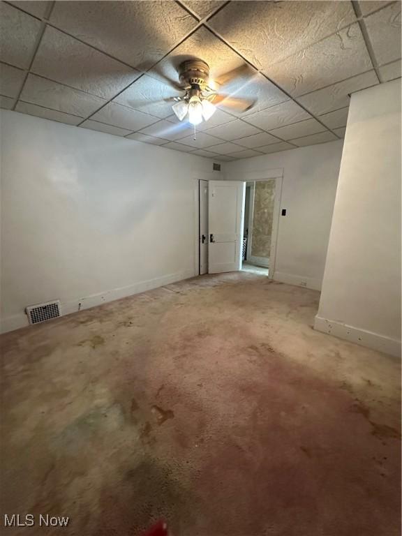 1097 Jefferson St, Follansbee, WV 26037 - empty room featuring ceiling fan, a drop ceiling, and baseboards