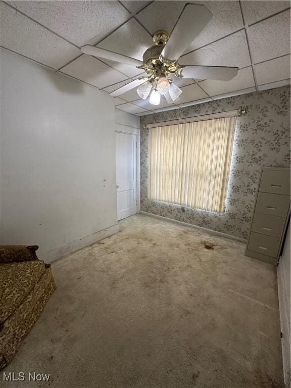 1097 Jefferson St, Follansbee, WV 26037 - carpeted empty room featuring a paneled ceiling, a ceiling fan, wallpapered walls, and baseboards
