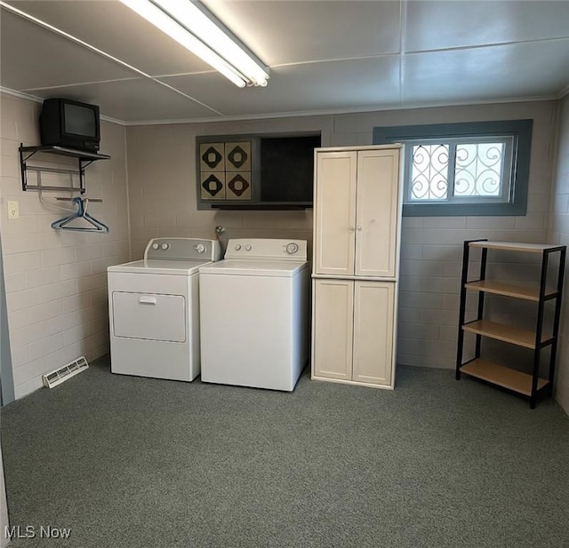 1097 Jefferson St, Follansbee, WV 26037 - laundry area with cabinet space, washing machine and dryer, concrete block wall, carpet, and ornamental molding