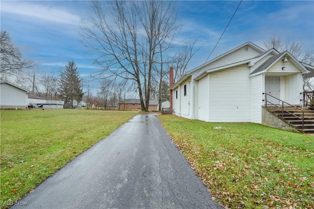 1187 Deforest Rd SE, Warren, OH 44484 - view of property exterior with a yard and a chimney