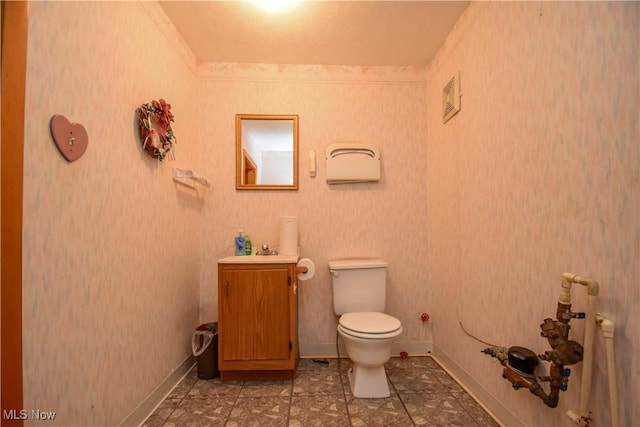 1187 Deforest Rd SE, Warren, OH 44484 - half bath featuring toilet, vanity, and baseboards