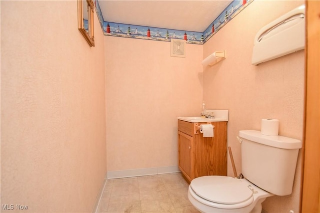 1187 Deforest Rd SE, Warren, OH 44484 - half bathroom with toilet, vanity, and tile patterned floors