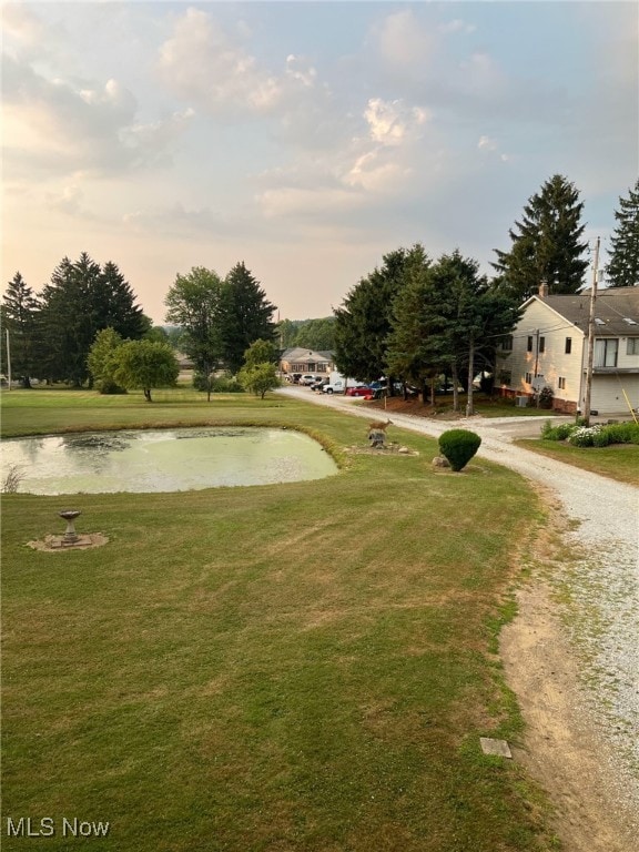 988 E Turkeyfoot Lake Rd, Green, OH 44312 - view of property's community with a yard and a water view