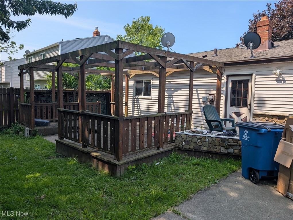 1009 E 347th St, Eastlake, OH 44095 - wooden terrace featuring an outdoor fire pit