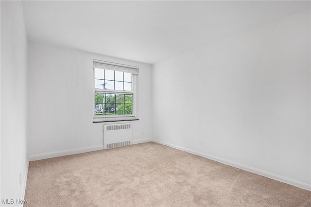 19101 Van Aken Blvd Unit 218, Shaker Heights, OH 44122 - empty room with radiator heating unit, carpet, and baseboards