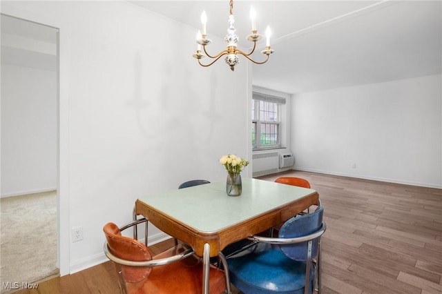 19101 Van Aken Blvd Unit 218, Shaker Heights, OH 44122 - dining area featuring a chandelier, wood finished floors, baseboards, and an office area