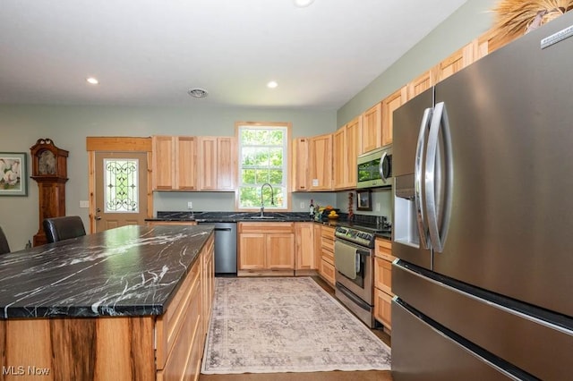 24416 Mountz Rd, Homeworth, OH 44634 - kitchen with stainless steel appliances, recessed lighting, a kitchen island, a sink, and light brown cabinets