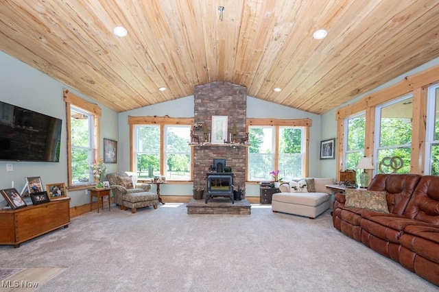 24416 Mountz Rd, Homeworth, OH 44634 - living room featuring a wood stove, lofted ceiling, wooden ceiling, carpet flooring, and plenty of natural light