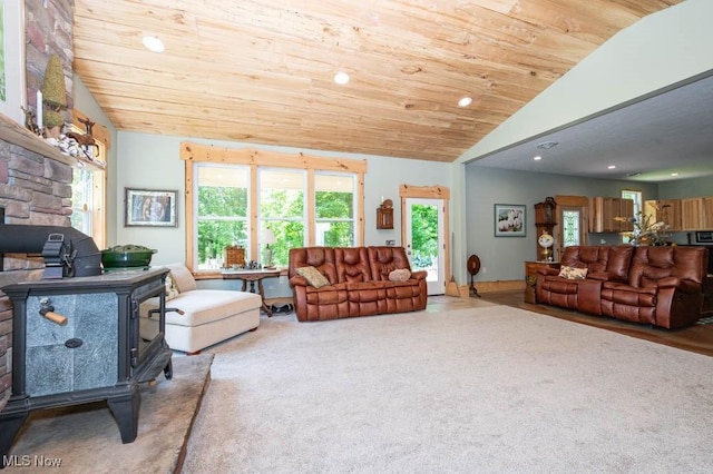 24416 Mountz Rd, Homeworth, OH 44634 - living room with vaulted ceiling, a wood stove, wood ceiling, recessed lighting, and carpet